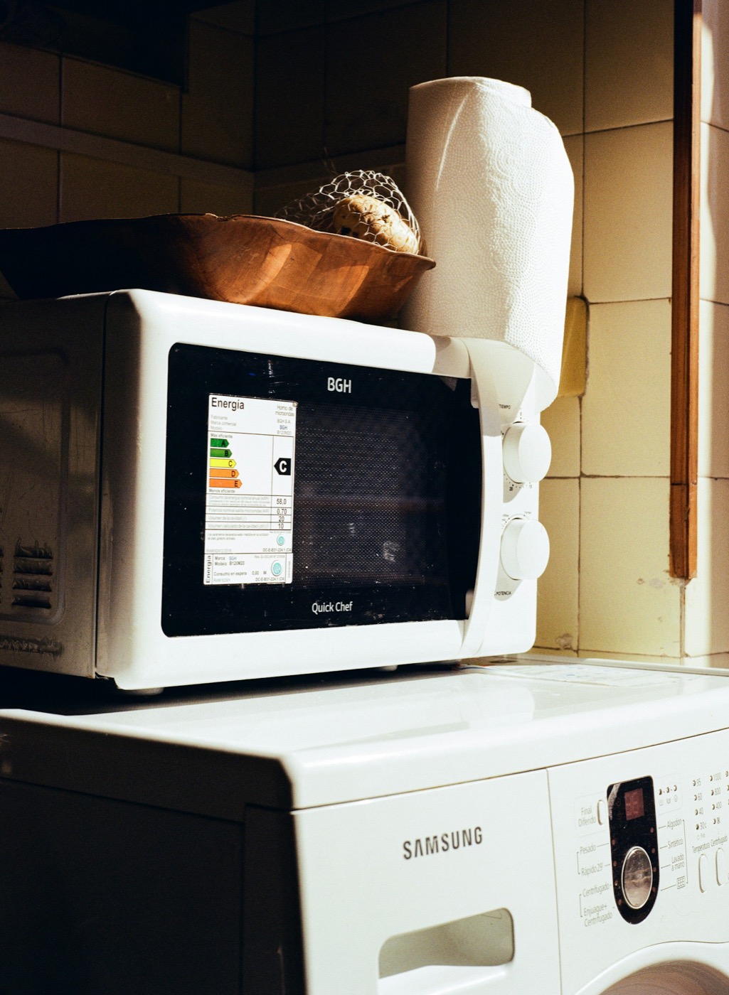 A two-knob microwave on a washing machine with twenty programs. Photo by Ruben Mavarez on Unsplash