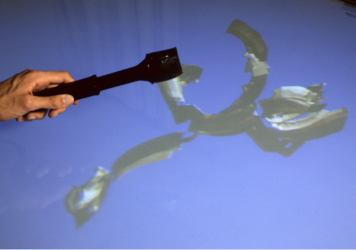 Kitchen tongs move a drawing.